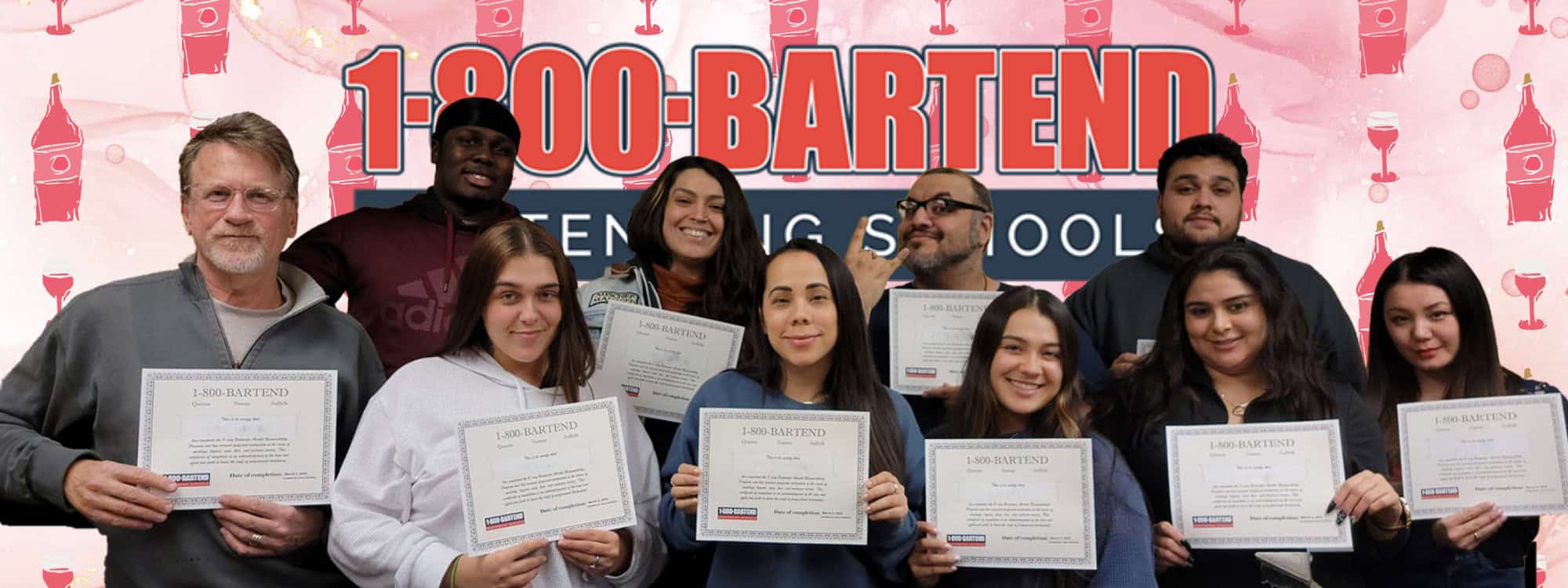 A diverse group of people stands in front of a backdrop featuring the "1-800-BARTEND" logo. Each individual proudly holds a certificate, suggesting they have completed a bartending course at Bartending School NY.